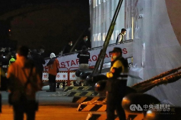 Health and Welfare Minister Chen Shih-chung (back right) boards the SuperStar Aquarius in Keelung Harbor on Friday./Photo courtesy of CNA