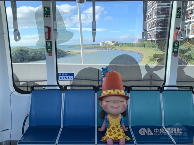 A character from illustrator Jimmy Liao's works is placed in the carriage. The artist's works can be seen across the Danhai Light Rail network. CNA photo Nov. 14, 2020